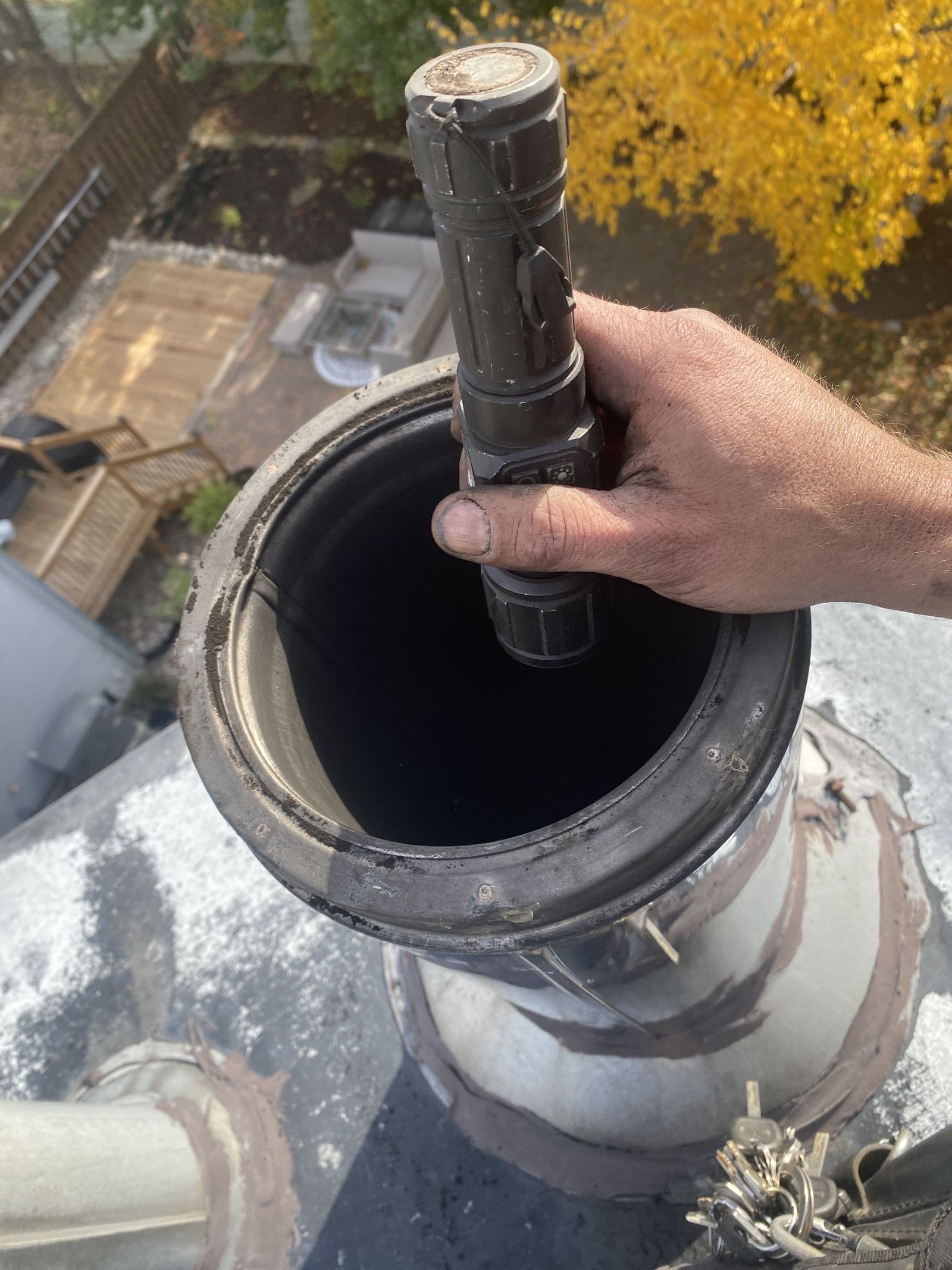 Inspecting a chimney liner with a flashlight