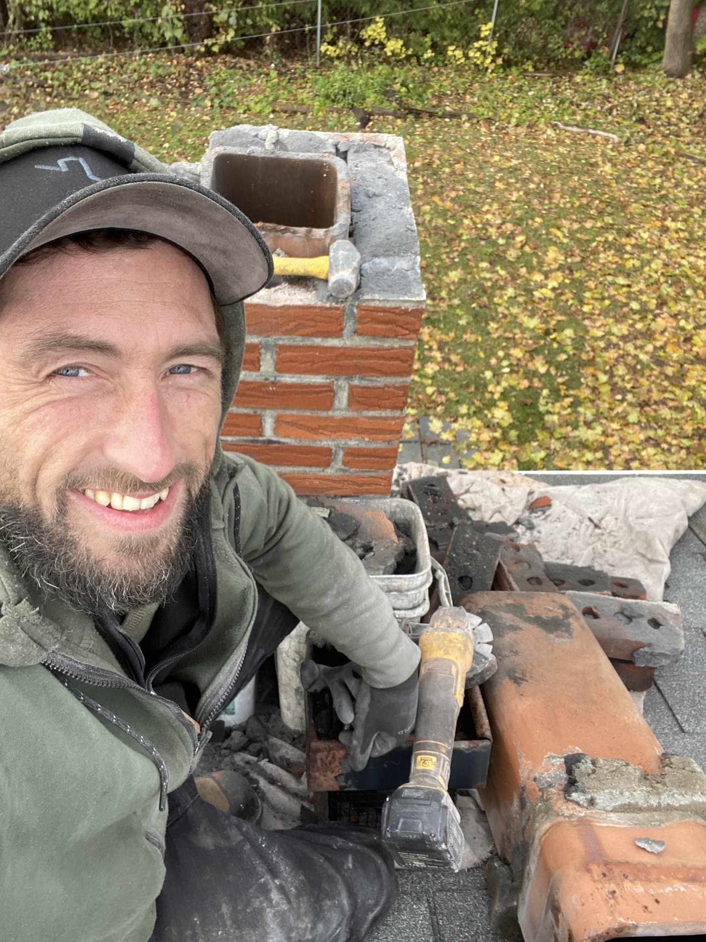 Jacob on a rooftop during a chimney repair